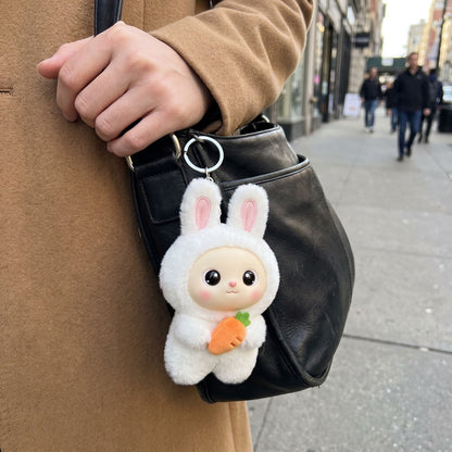 Snow Bunny Bag Charm on a shoulder bag